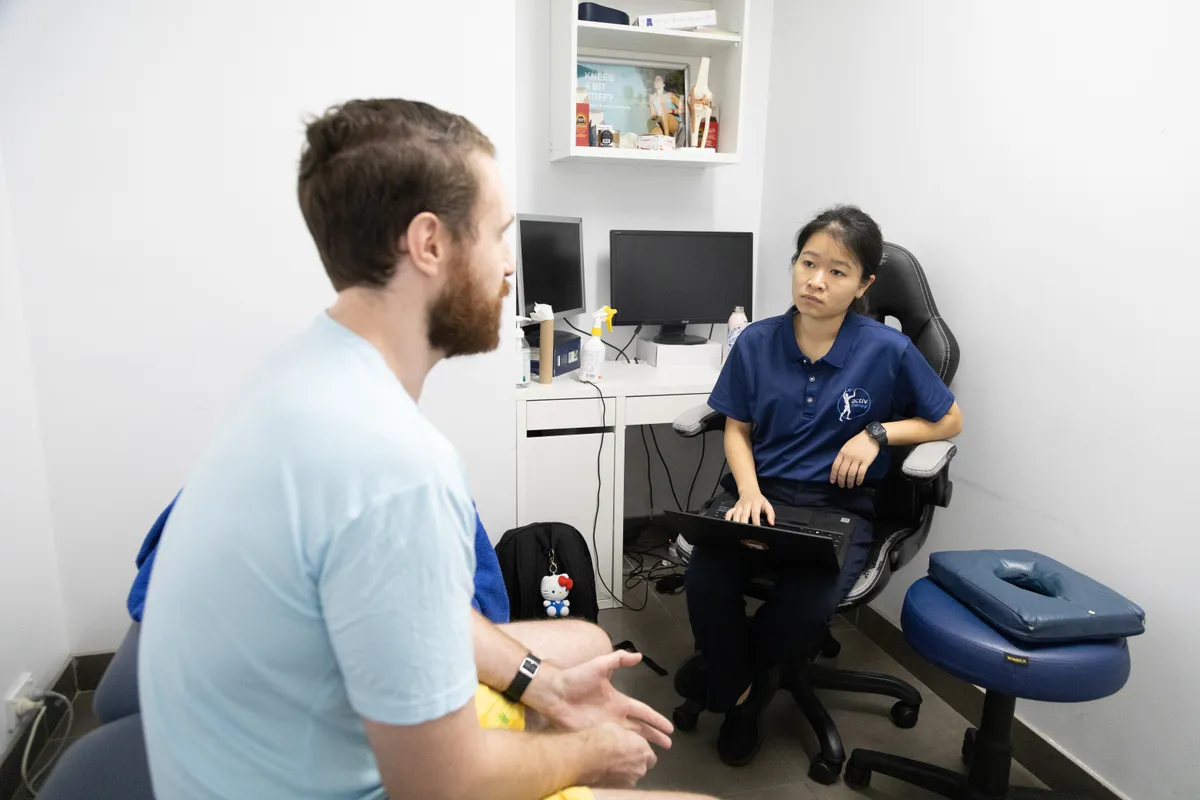 Clinician taking a patient history at the start of an appointment
